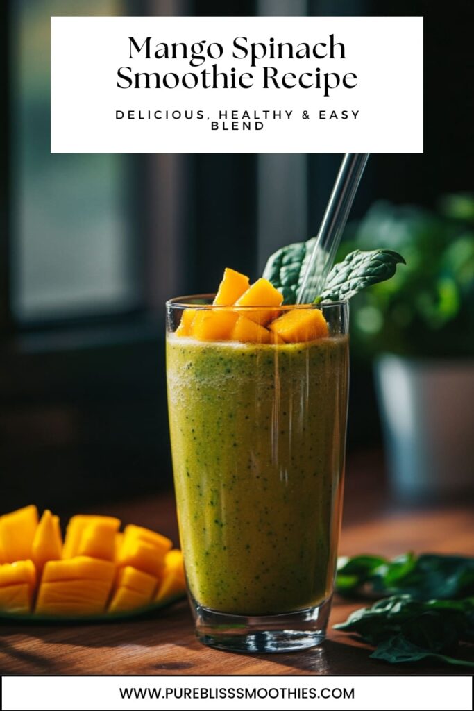 Mango Spinach Smoothie Recipe | Delicious, Healthy & Easy Blend – A glass of vibrant green smoothie made with mango and spinach, garnished with fresh mango cubes and a spinach leaf, served with a glass straw.