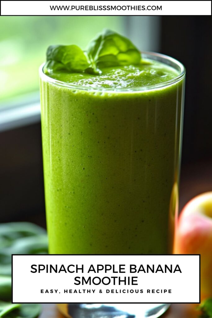 Green Spinach Apple Banana Smoothie in a glass, garnished with fresh spinach leaves. A healthy, refreshing, and easy recipe for a nutrient-packed drink.